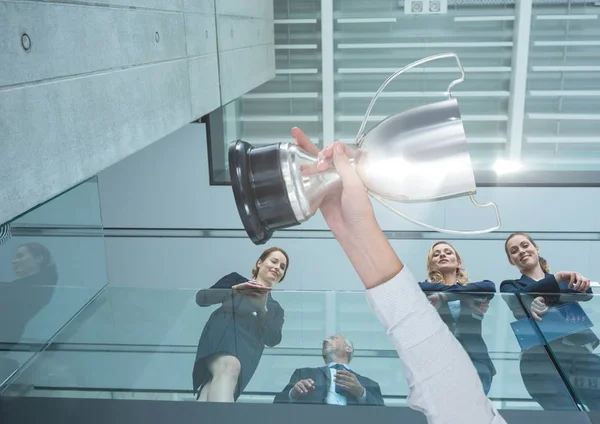 Business hand with trophy — Stock Photo, Image
