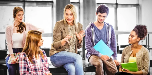 Students talking with their teacher — Stock Photo, Image