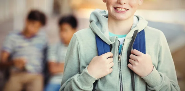 Schoolboy standing with schoolbag — Stock Photo, Image