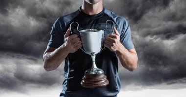 Man with a trophy on hands clipart