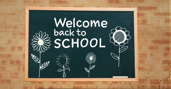 Bienvenido de nuevo al texto de la escuela y flores — Foto de Stock