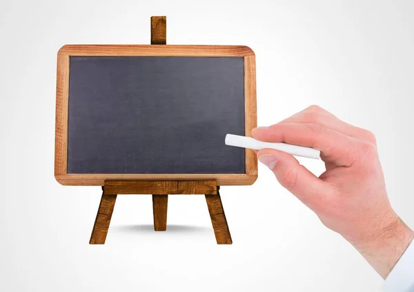 Hand writing with chalk on empty blackboard — Stock Photo, Image