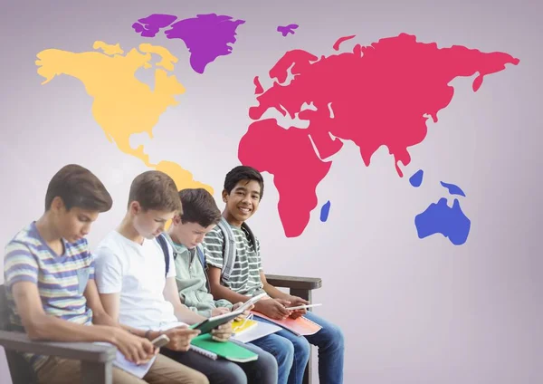 Kids sitting in front of colorful world map — Stock Photo, Image