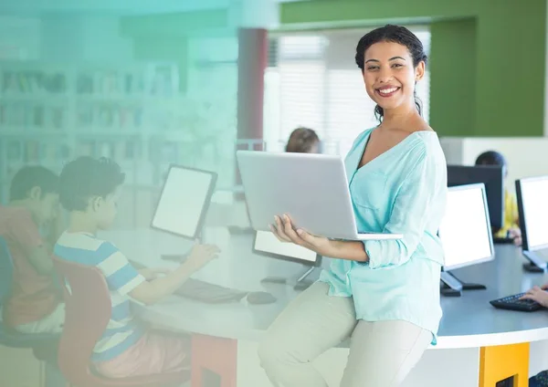 Teacher with class in computer room Royalty Free Stock Images