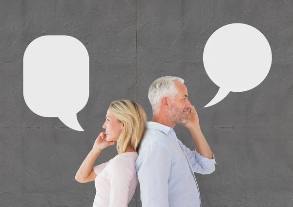 Couple with speech bubble talking on phone — Stock Photo, Image