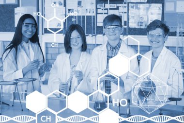 okul çocukları kimyasal bir deney yapıyor