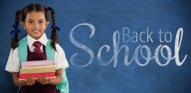 kitap taşıyan kız öğrenci