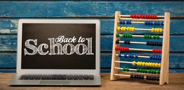 Back to school text on laptop screen — Stock Photo, Image