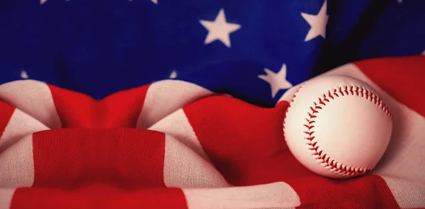 Baseball ball on crumbled national flag — Stock Photo, Image