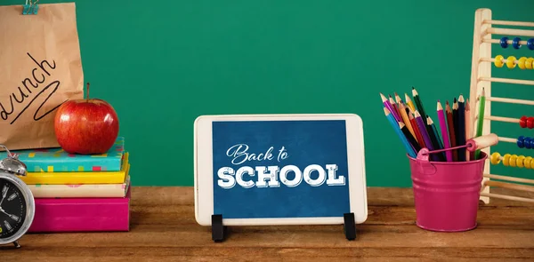 School supplies with tablet on table — Stock Photo, Image