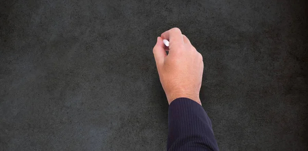 Hand av en affärsman som skriver med en krita — Stockfoto
