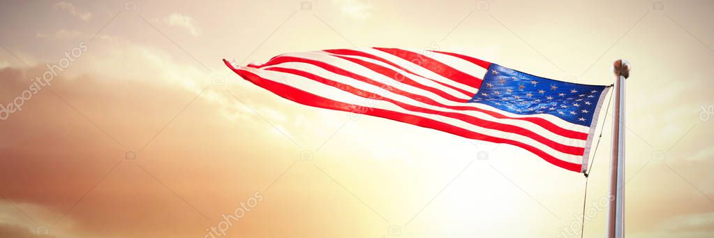 American flag waving against of beach