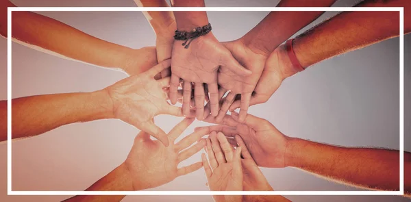 Directly below shot of friends stacking hands