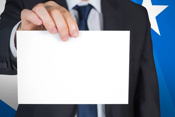 Mature businessman showing card — Stock Photo, Image