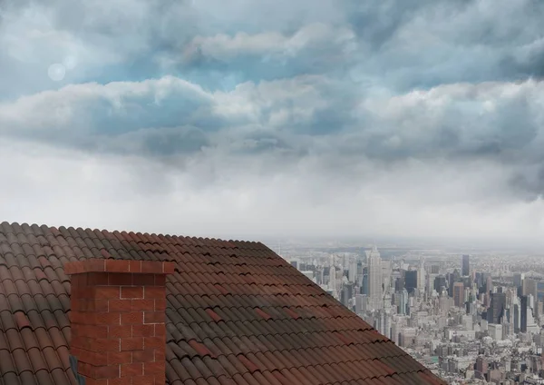 Roof with chimney and city clouds — Stock Photo, Image