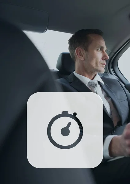 Icono del reloj contra el hombre en el coche — Foto de Stock