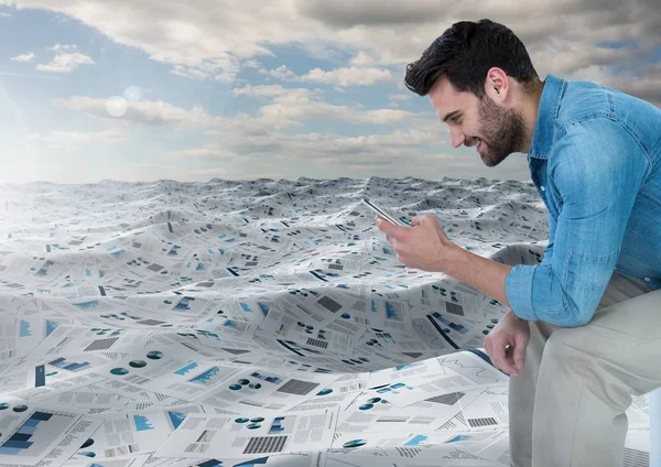 Zakenman op telefoon in zee van documenten — Stockfoto