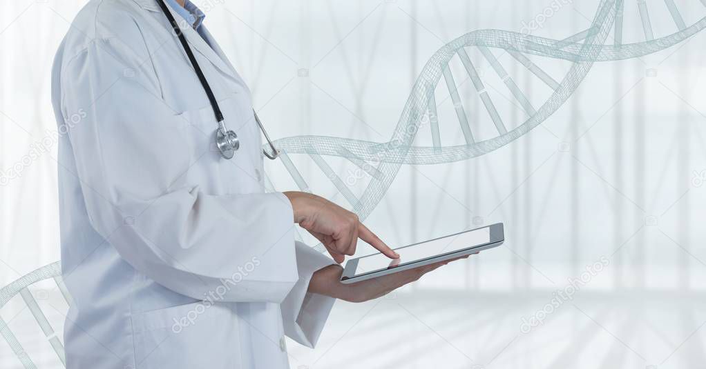 Doctor using a tablet with DNA strand