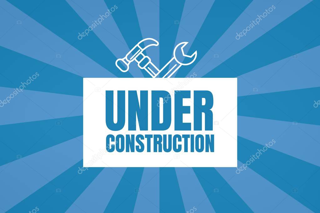 Under construction text with tools graphics