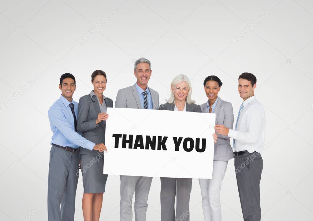 Business people holding a card with thank you text