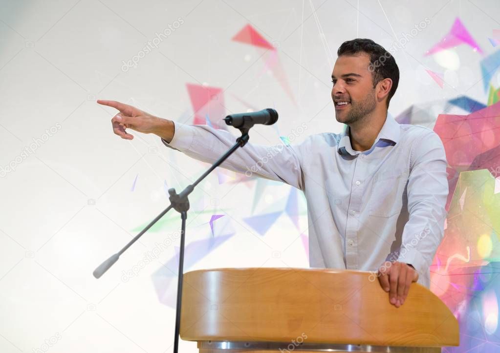 Businessman on podium speaking at conference 