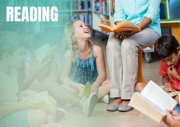 Reading text and Elementary School teacher with class — Stock Photo, Image