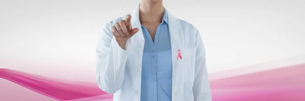Doctor woman with breast cancer awareness ribbon — Stock Photo, Image