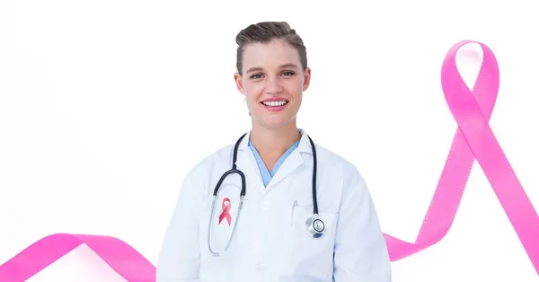 Doctor with breast cancer awareness ribbon — Stock Photo, Image