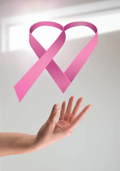 Open hand with pink ribbon — Stock Photo, Image
