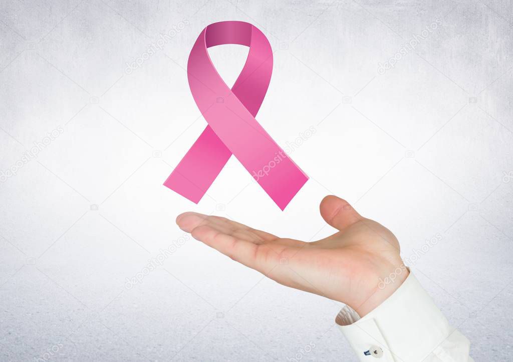 Open hand with pink ribbon for breast cancer 