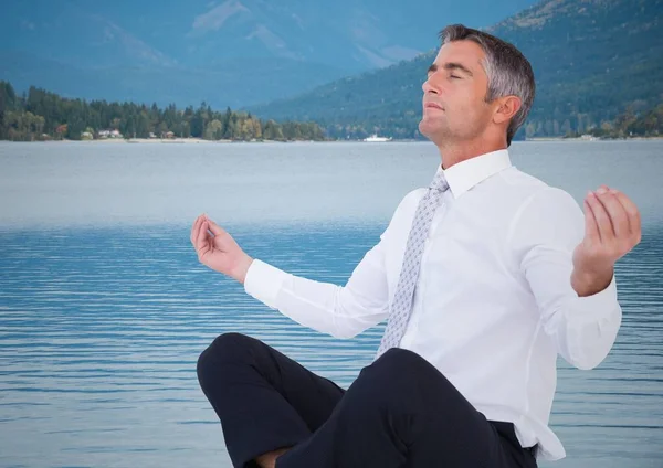 Business man meditating — Stock Photo, Image