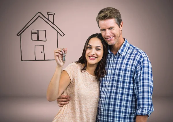Par innehav nyckel med hus — Stockfoto