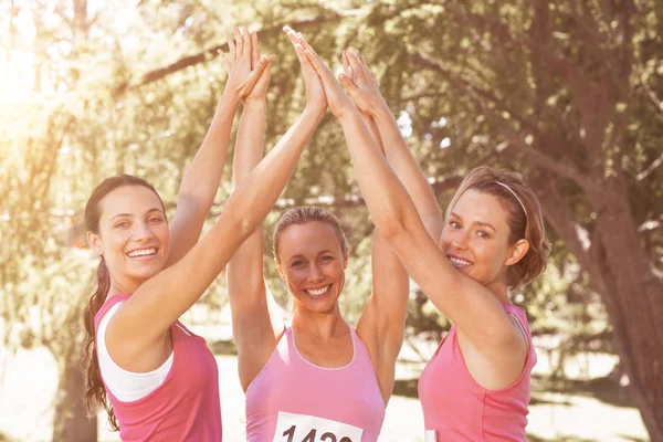 Women running for breast cancer awareness — Stock Photo, Image