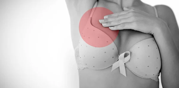Woman in bra with breast cancer awareness ribbon — Stock Photo, Image