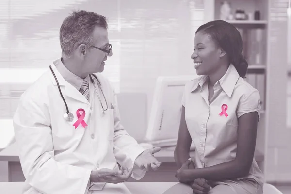 Doctor speaking with cheerful young patient — Stock Photo, Image