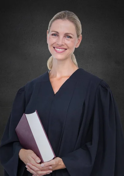 Judge with book against grey wall — Stock Photo, Image