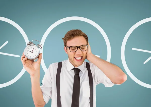 Annoyed business man holding clock