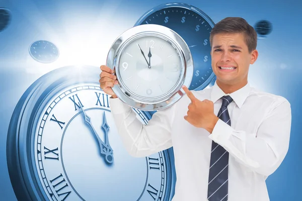 Businessman showing a clock — Stock Photo, Image