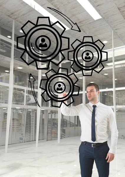 Business man interacting with people in cogs — Stock Photo, Image