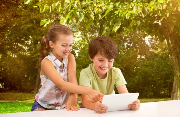 Boy with sister using digital tablet — Stock Photo, Image