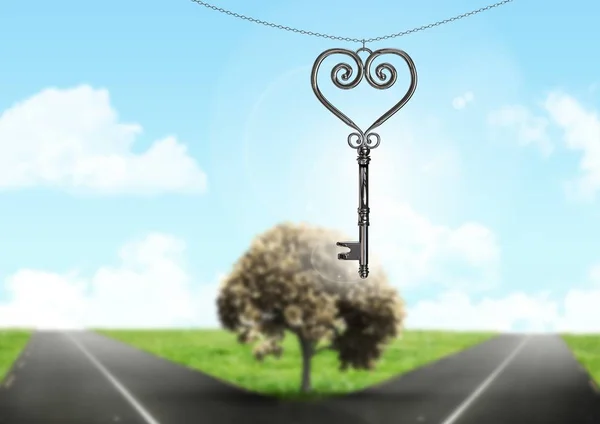 3D Heart Key floating over parting road — Stock Photo, Image