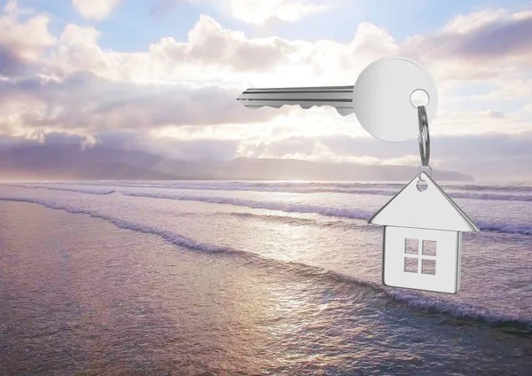 Ключ 3D House, плавающий над морем — стоковое фото