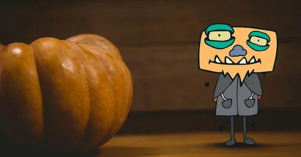 Monster cartoon next to halloween pumpkin — Stock Photo, Image