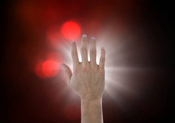 Mão tocando o ar com brilho — Fotografia de Stock