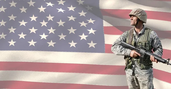 Veterans day soldier in front of flag — Stock Photo, Image