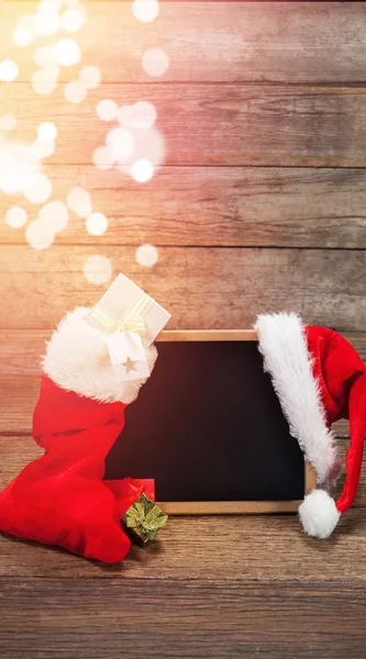 Santa hat and Christmas stocking — Stock Photo, Image