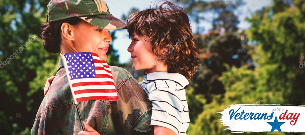 Army woman carrying son against logo for veterans day in america