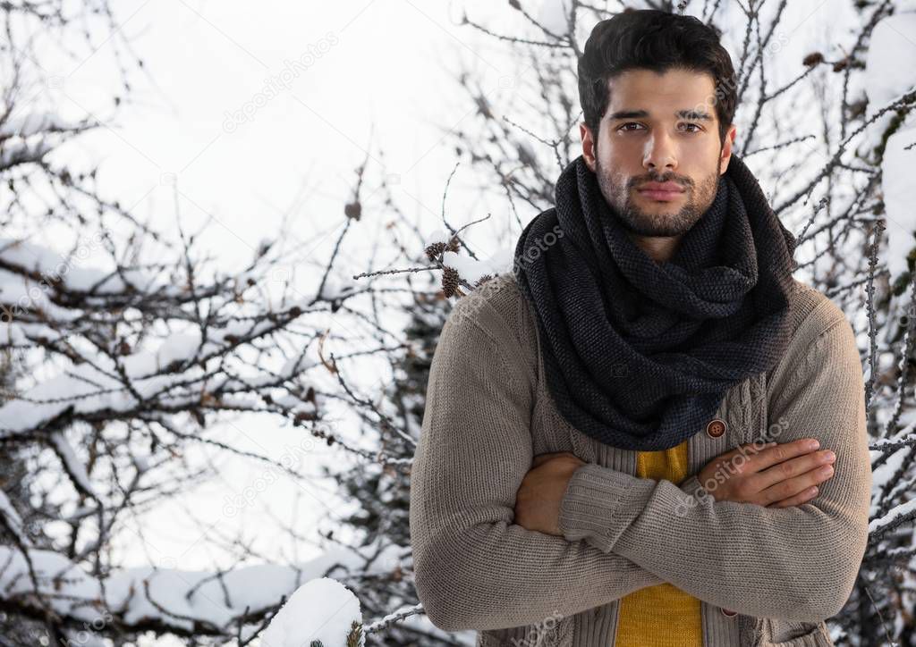Man wearing scarf with arms folded 