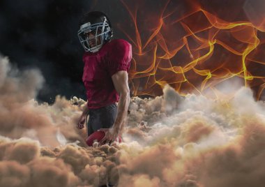 Yangın arka plan ile Amerikan futbolu oyuncusu