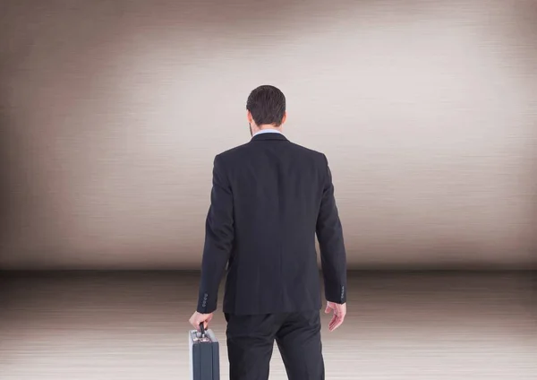 Businessman with briefcase in room — Stock Photo, Image